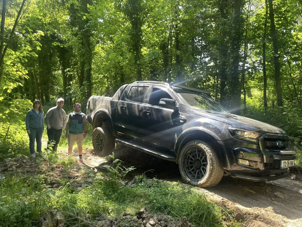 4x4 pickup navigating steep terrain on rural track during LANTRA off-road training in Ireland