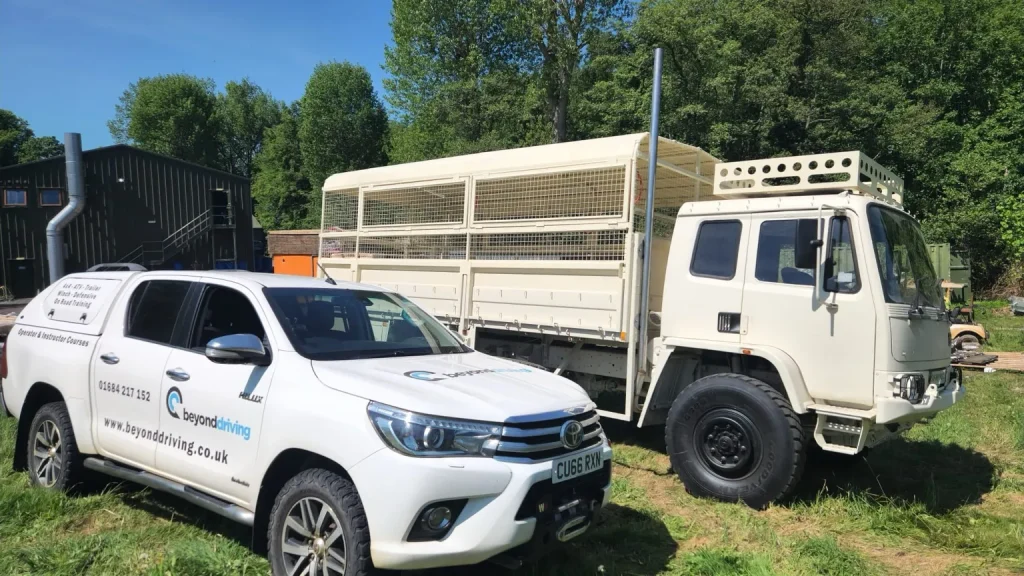 Beyond Driving 4x4 Hilux and safari truck parked side by side