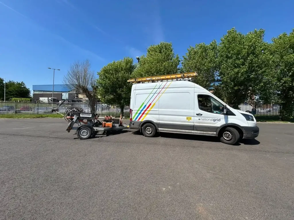 National Grid van towing a cable drum trailer during Beyond Driving trailer handling training in a depot car park