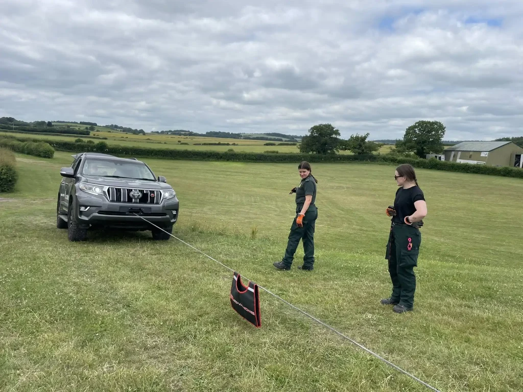 wo NHS HART trainees conducting winch recovery practice on a Toyota 4x4 during Beyond Driving training near Andover