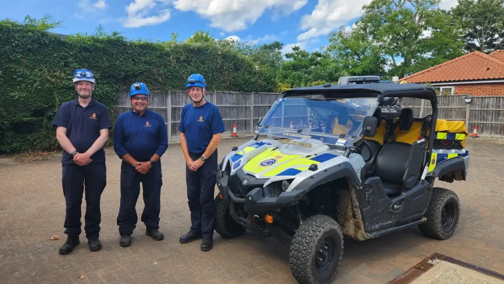 HM Coastguard team members standing beside Polaris UTV after Lantra off-road driver training