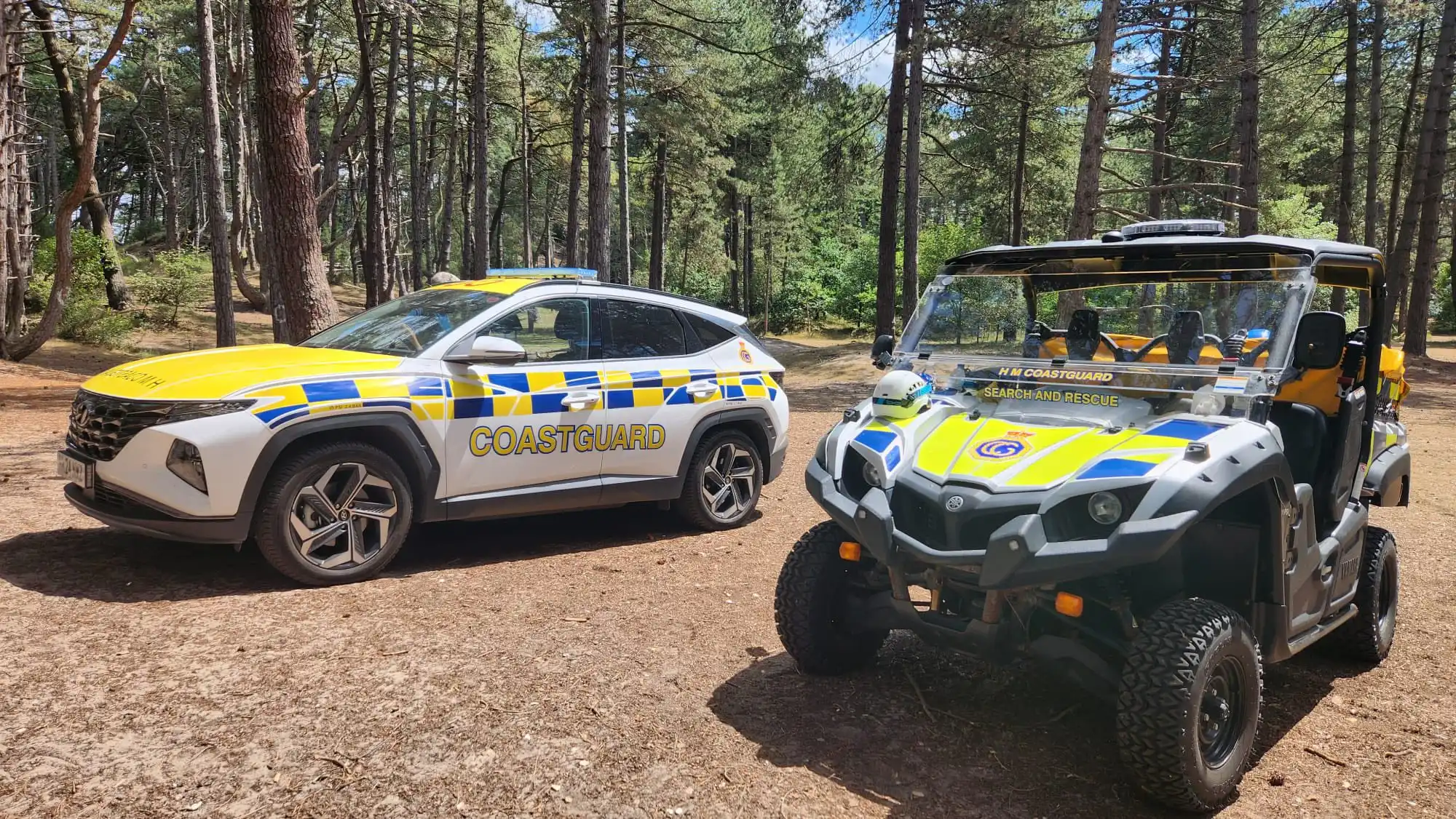 HM Coastguard Hyundai and Polaris UTV parked in forest during Lantra UTV training in North Norfolk
