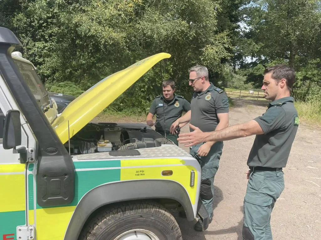 Instructor demonstrating engine checks to NHS HART personnel during Qualsafe 4x4 instructor course