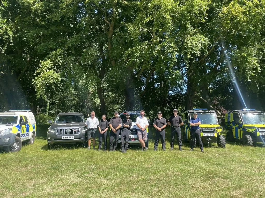 Humberside Police Rural Task Force standing in front of off-road vehicles and UTVs during Lantra training