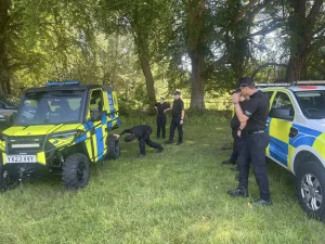 Police officers inspecting Polaris Ranger UTV during Lantra Sit-In ATV training with Beyond Driving