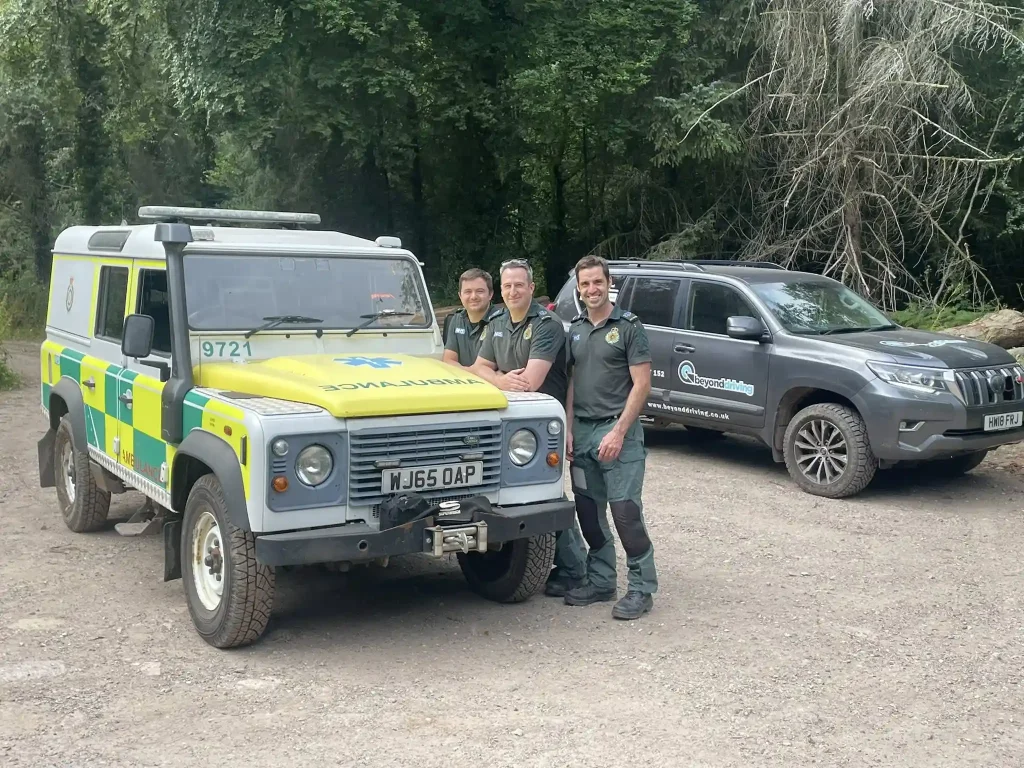 NHS HART team members with Beyond Driving 4x4 training vehicle and emergency ambulances during Qualsafe instructor course near Exeter
