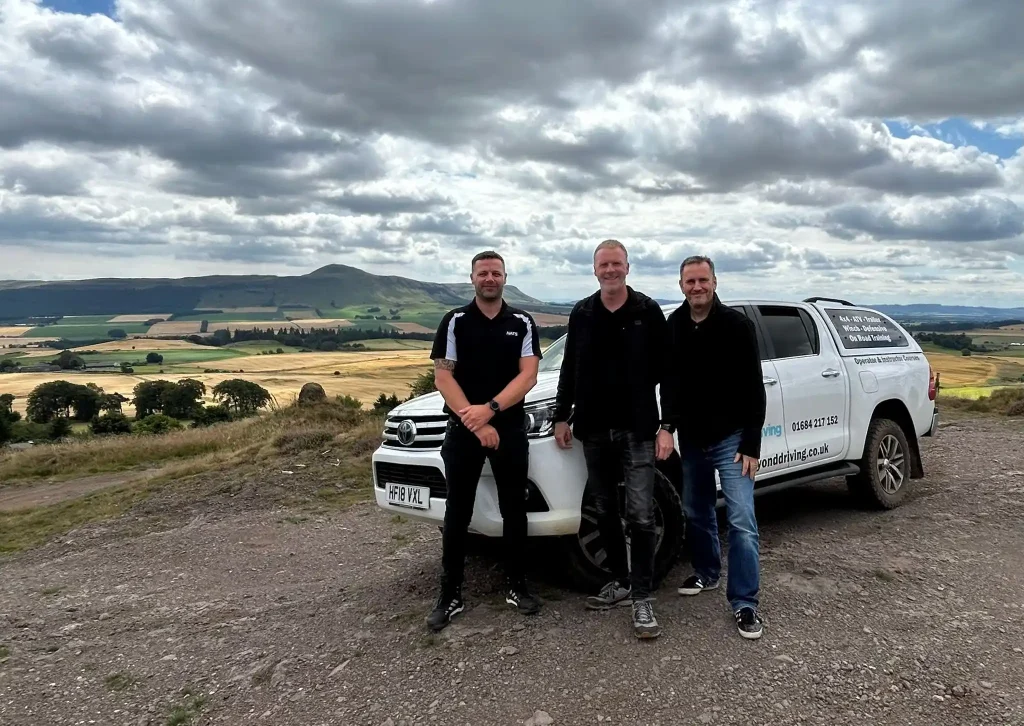 Beyond Driving instructor with NATS team during Lantra 4x4 training in Fife, overlooking the Scottish countryside