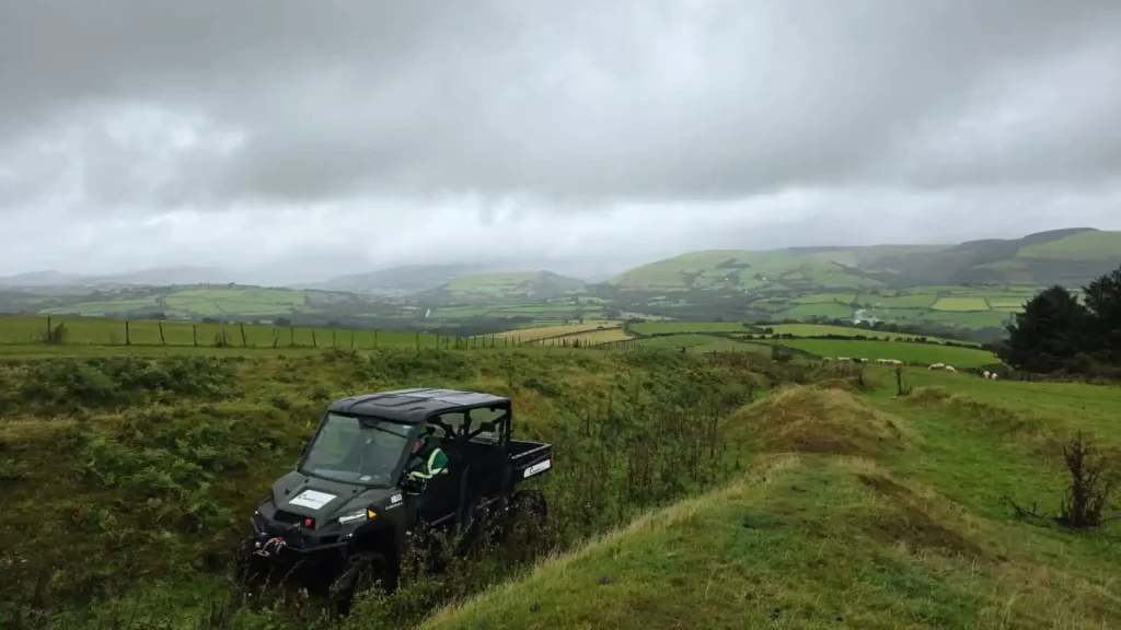 Polaris vehicle tackling uneven terrain during Beyond Driving winch training Wales