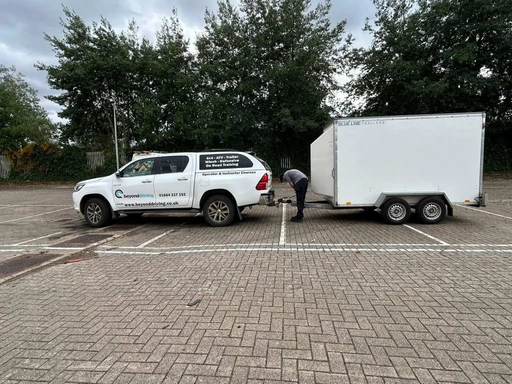 Trainee connecting Beyond Driving training trailer to 4x4 vehicle in Lincoln