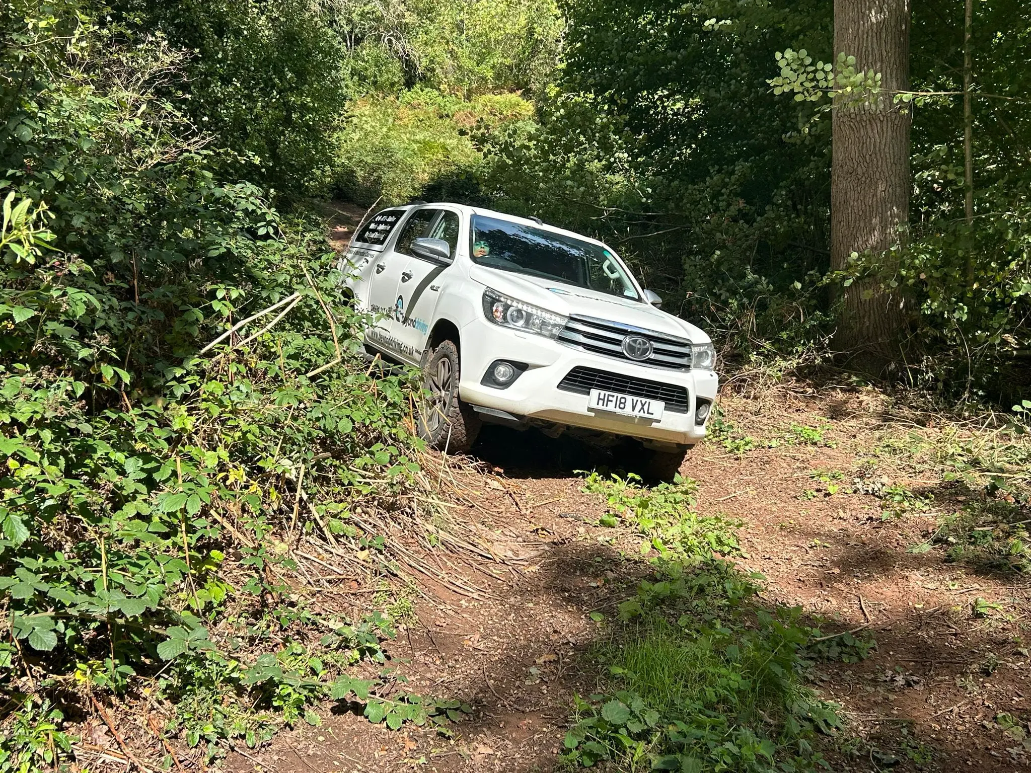 Toyota Hilux on woodland terrain during Lantra 4x4 course