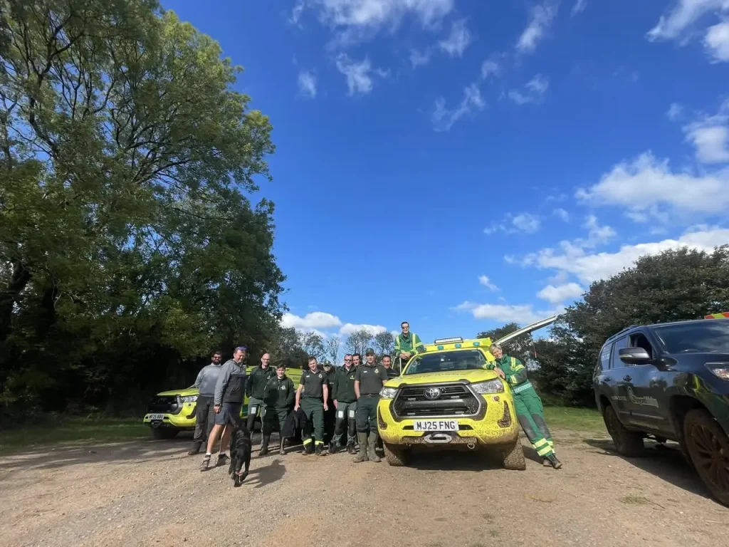 Group photo of SWASFT HART team with Beyond Driving instructors and vehicles