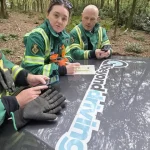 559945174_1300125445244236_3694401840272158606_n London Ambulance Service NHS HART team reviewing winch training notes on Beyond Driving vehicle bonnet