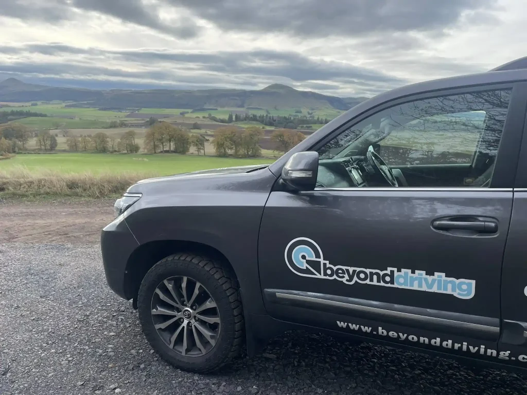 Beyond Driving 4x4 training vehicle overlooking rural Scottish landscape