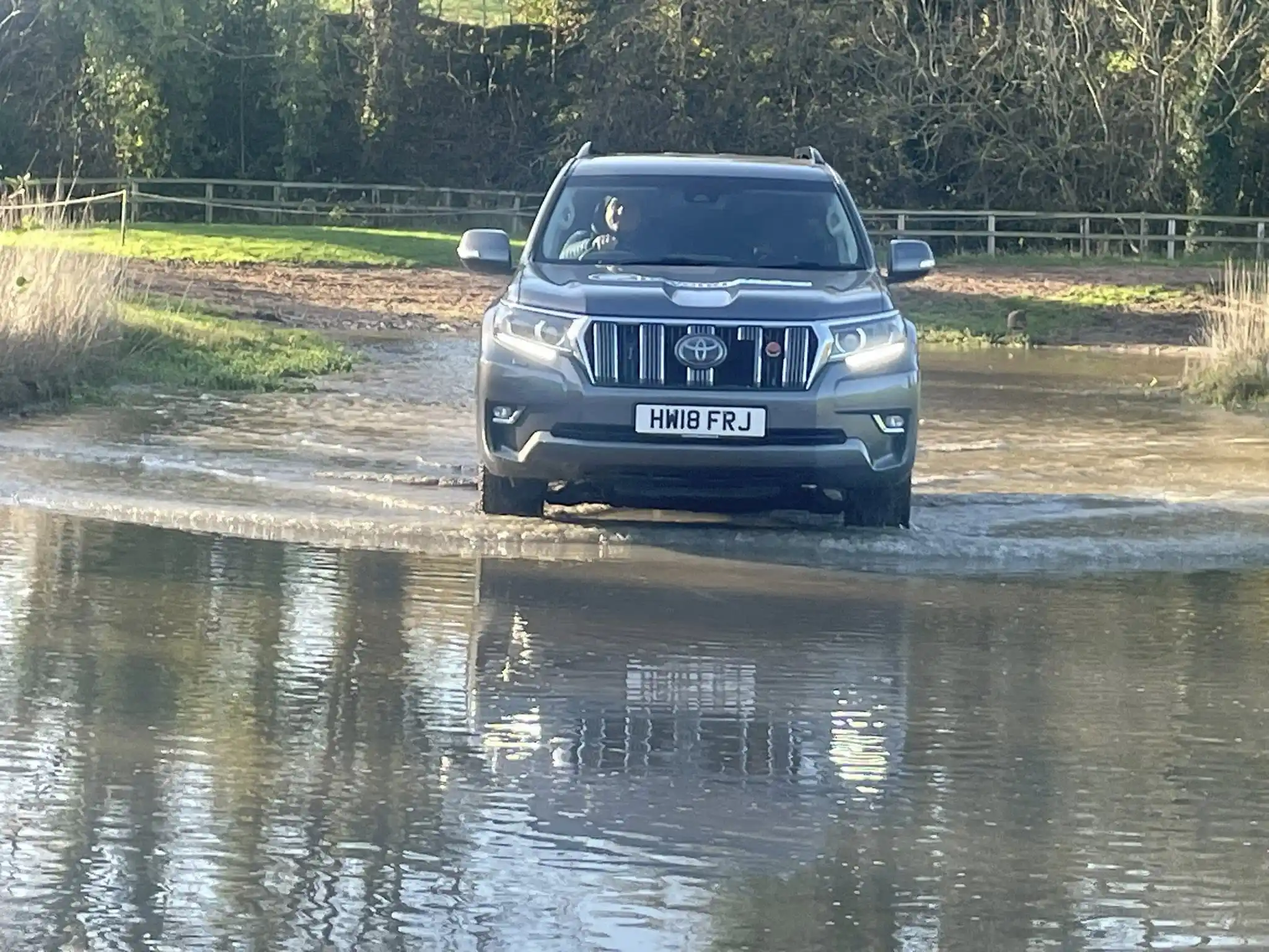 4x4 vehicle completing a controlled water crossing as part of Lantra off-road operator training.
