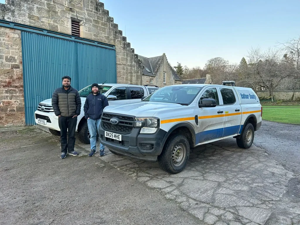 Beyond Driving instructors and Balfour Beatty delegates standing by their Ford Ranger during Lantra 4x4 training in Scotland