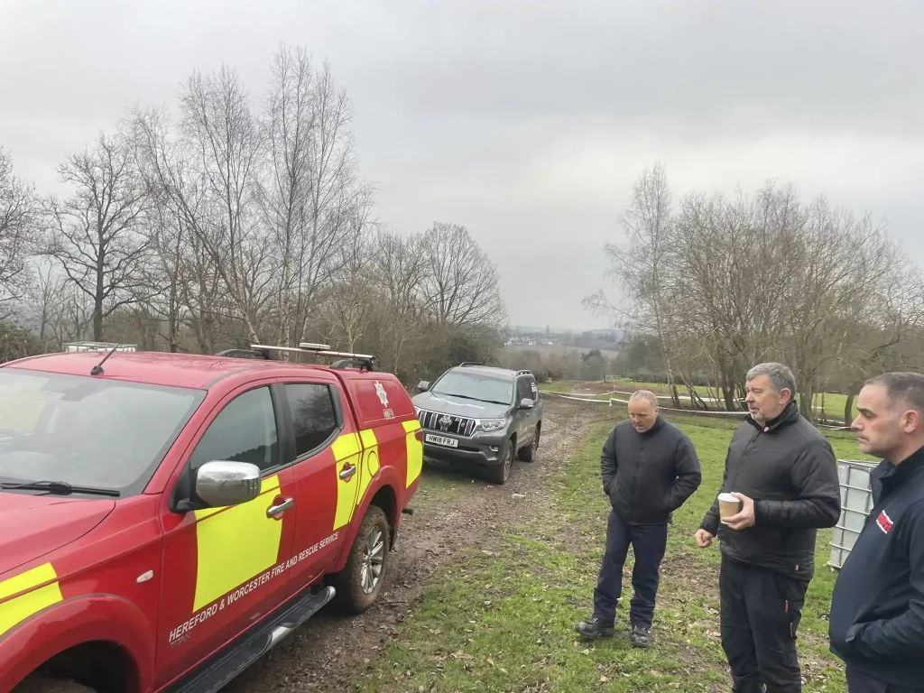 Hereford and Worcester Fire and Rescue instructors reviewing off-road driving techniques during Qualsafe 4x4 refresher course