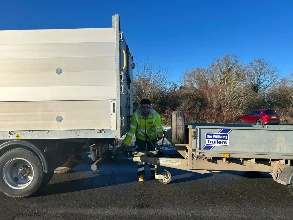 Operator coupling Ifor Williams trailer to light commercial vehicle during Lantra trailer handling training session