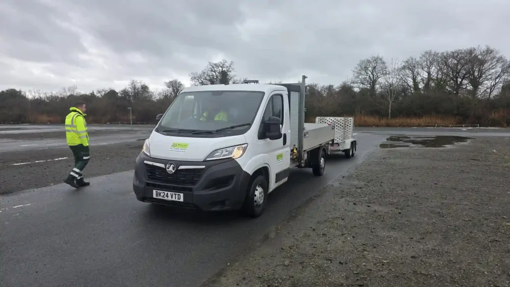 Light commercial vehicle towing equipment trailer during Lantra trailer handling training exercise at operational site