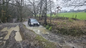 Openreach 4x4 vehicle completing flooded track driver training during Lantra 4x4 course delivered by Beyond Driving