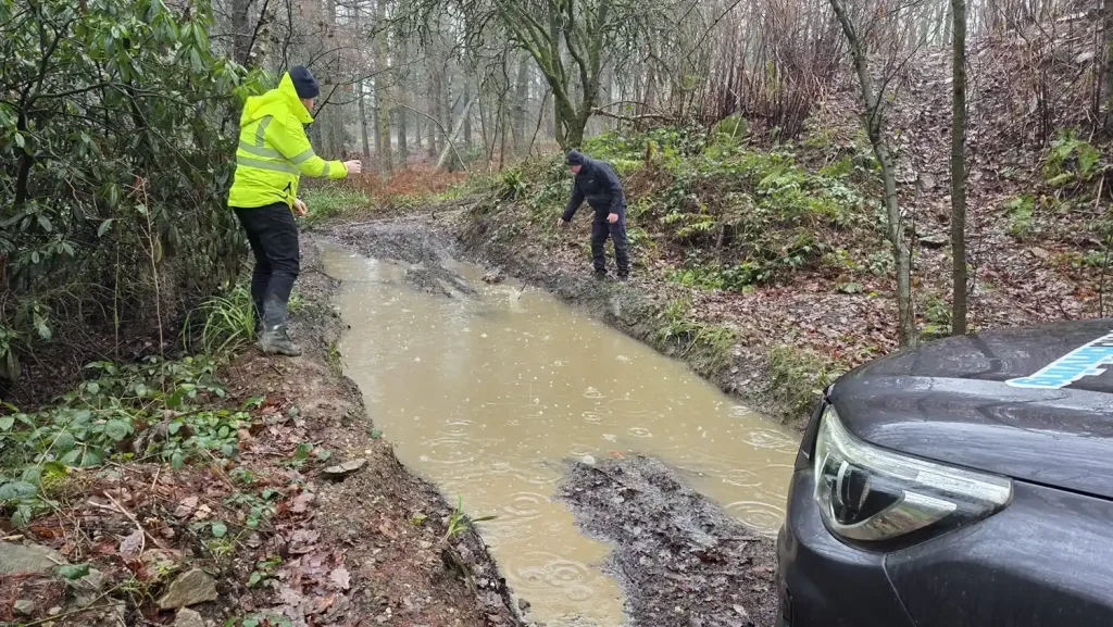 Beyond Driving trainees assessing flooded track depth as part of Lantra 4x4 training for Openreach drivers