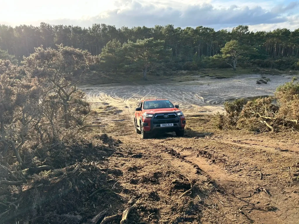 Balfour Beatty vehicle taking part in Lantra 4x4 operator training on steep off-road terrain in northern Scotland