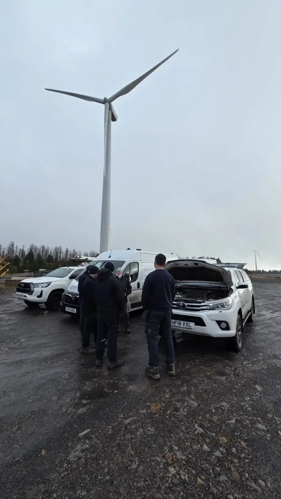 Lantra 4x4 training near Neath – Openreach team briefing beside vehicles at Welsh wind farm site
