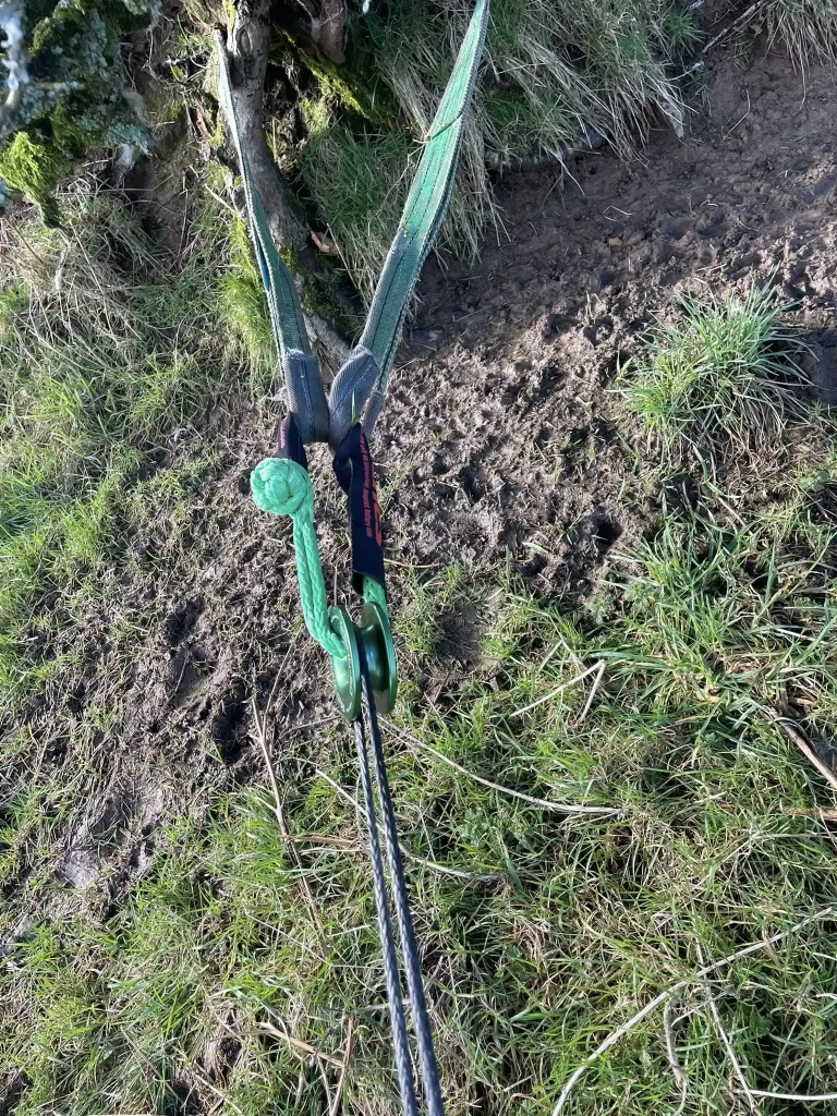 Winch recovery setup with tree strop and pulley block demonstrating safe rigging techniques during HART off-road recovery training