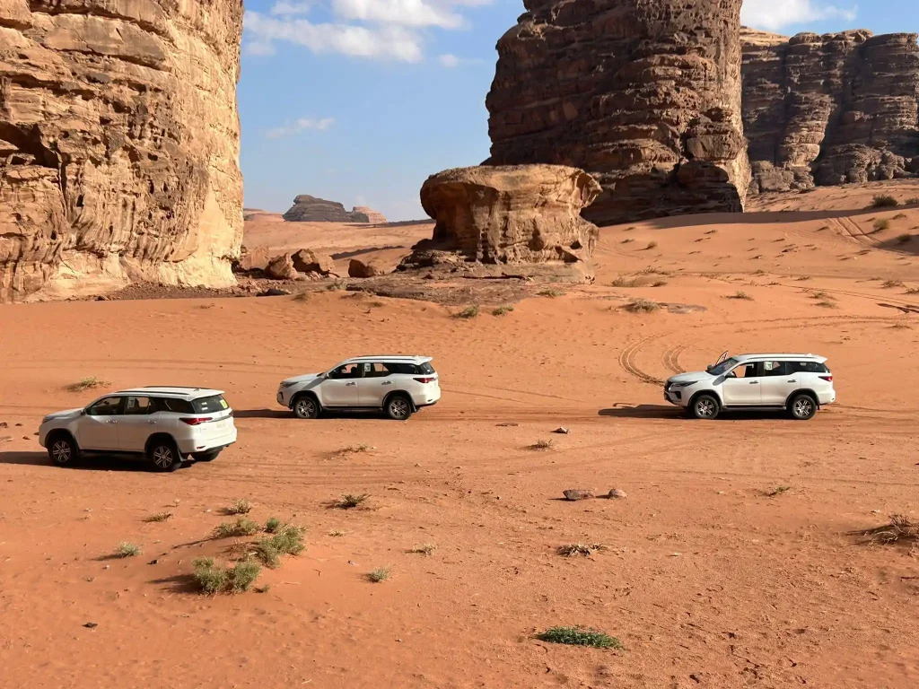 4x4 convoy driving through desert terrain during off-road driver training in Saudi Arabia