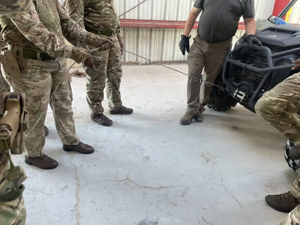 Instructor led briefing during vehicle recovery training exercise