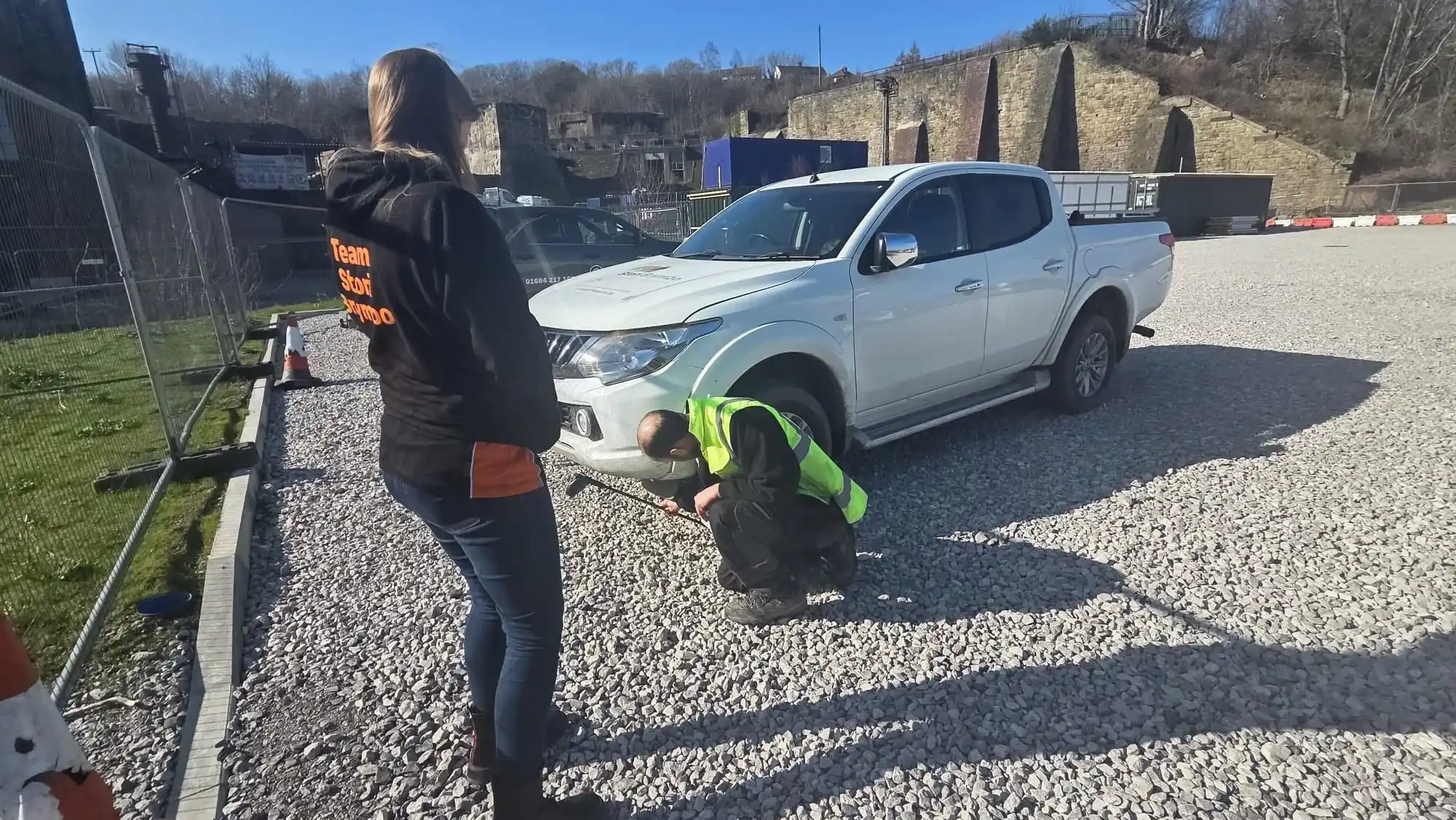 4x4 instructor training exercise inspecting vehicle recovery point during off-road driver training