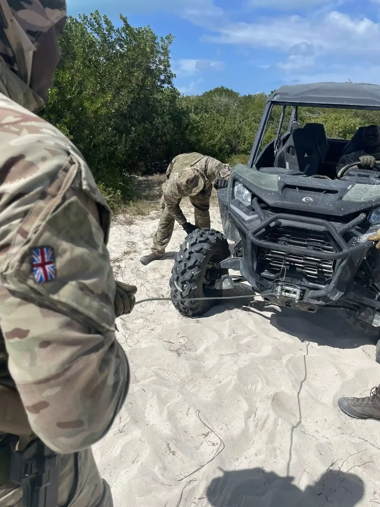 Instructor supervising vehicle recovery training exercise