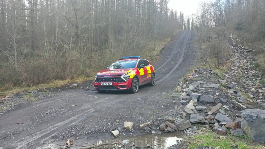 Emergency services vehicle navigating steep off-road terrain
