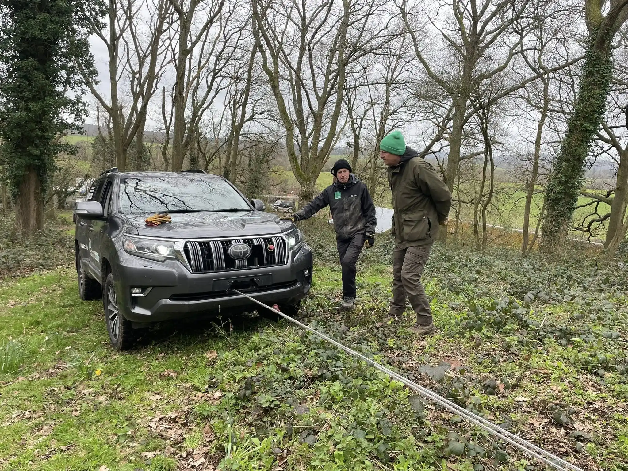 Instructor demonstrating safe winch attachment on 4x4 vehicle during Natural England training course