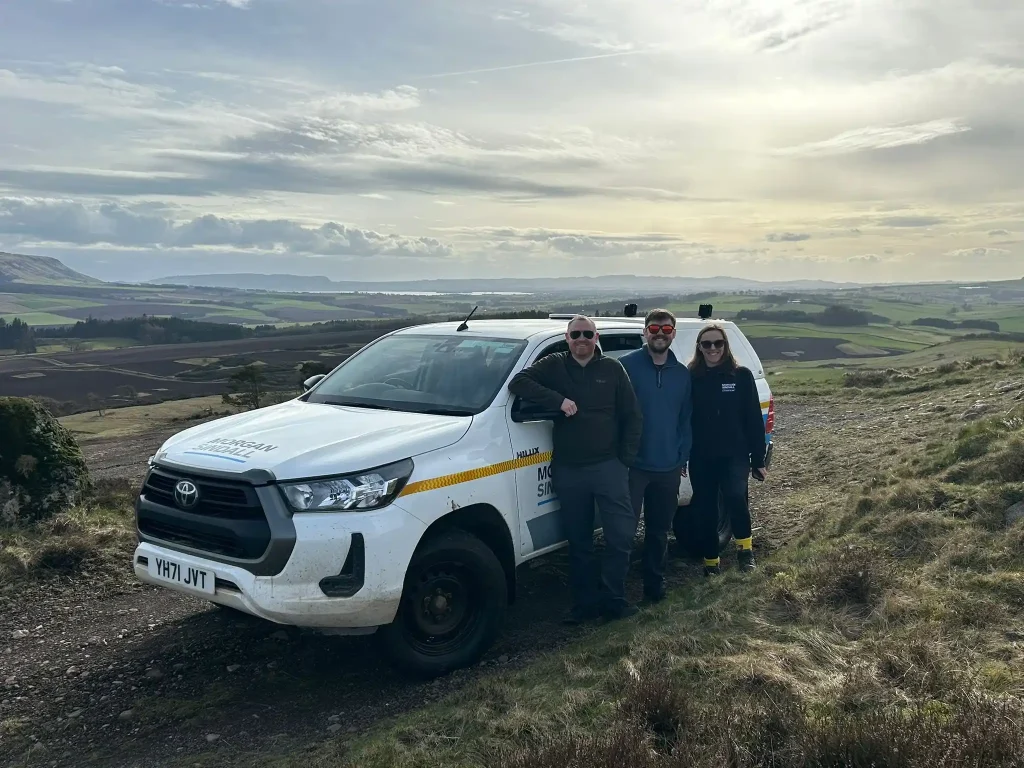 Morgan Sindall delegates and Beyond Driving instructors during Lantra 4x4 training on elevated terrain in Fife