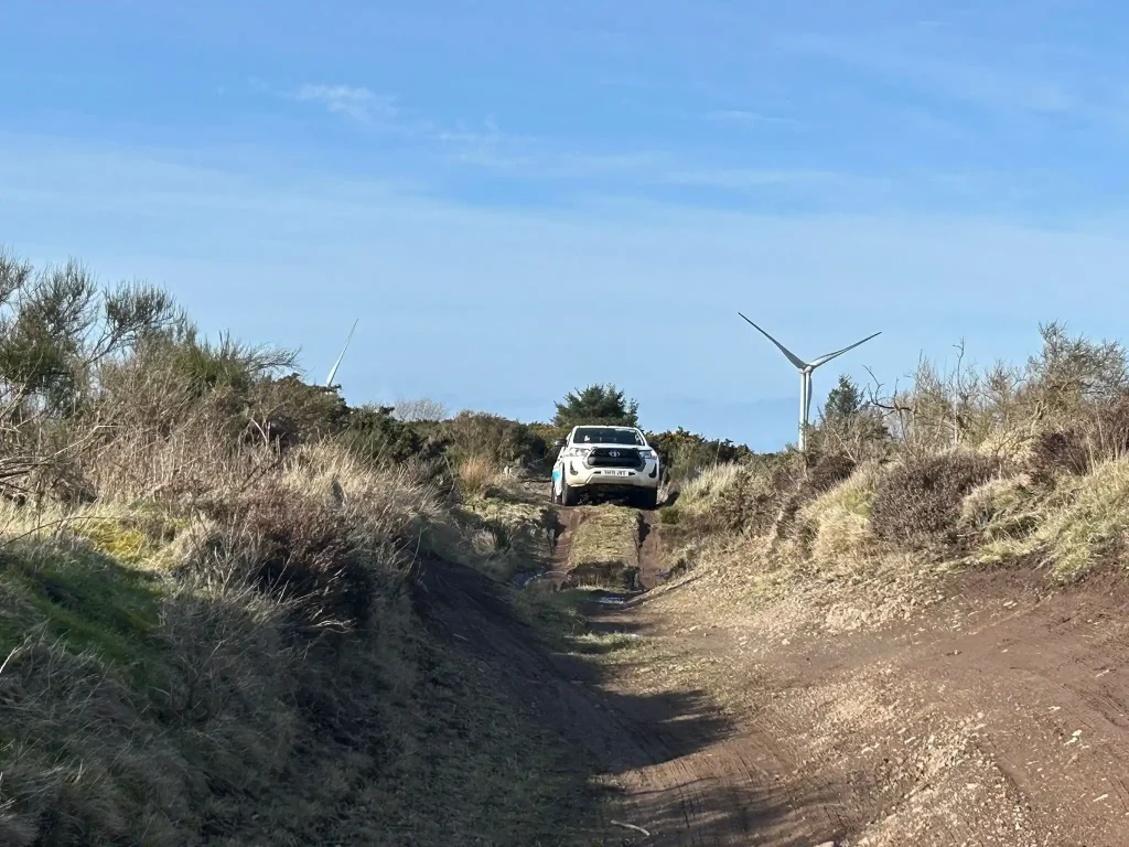 4x4 vehicle descending uneven off road track during Lantra training Scotland