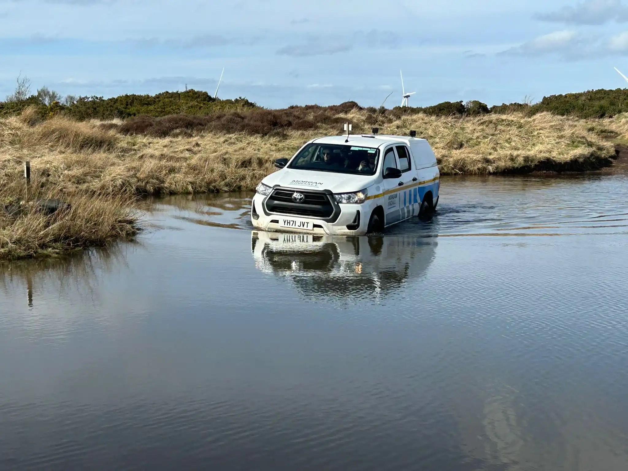 4x4 vehicle driving through water during Lantra operator training course Scotland