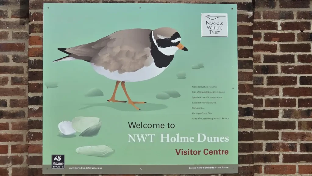 Norfolk Wildlife Trust Holme Dunes training location sign and nature reserve setting