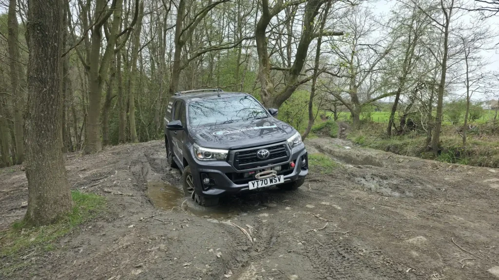 Off-road vehicle crossing water during Lantra 4x4 training near Bradford