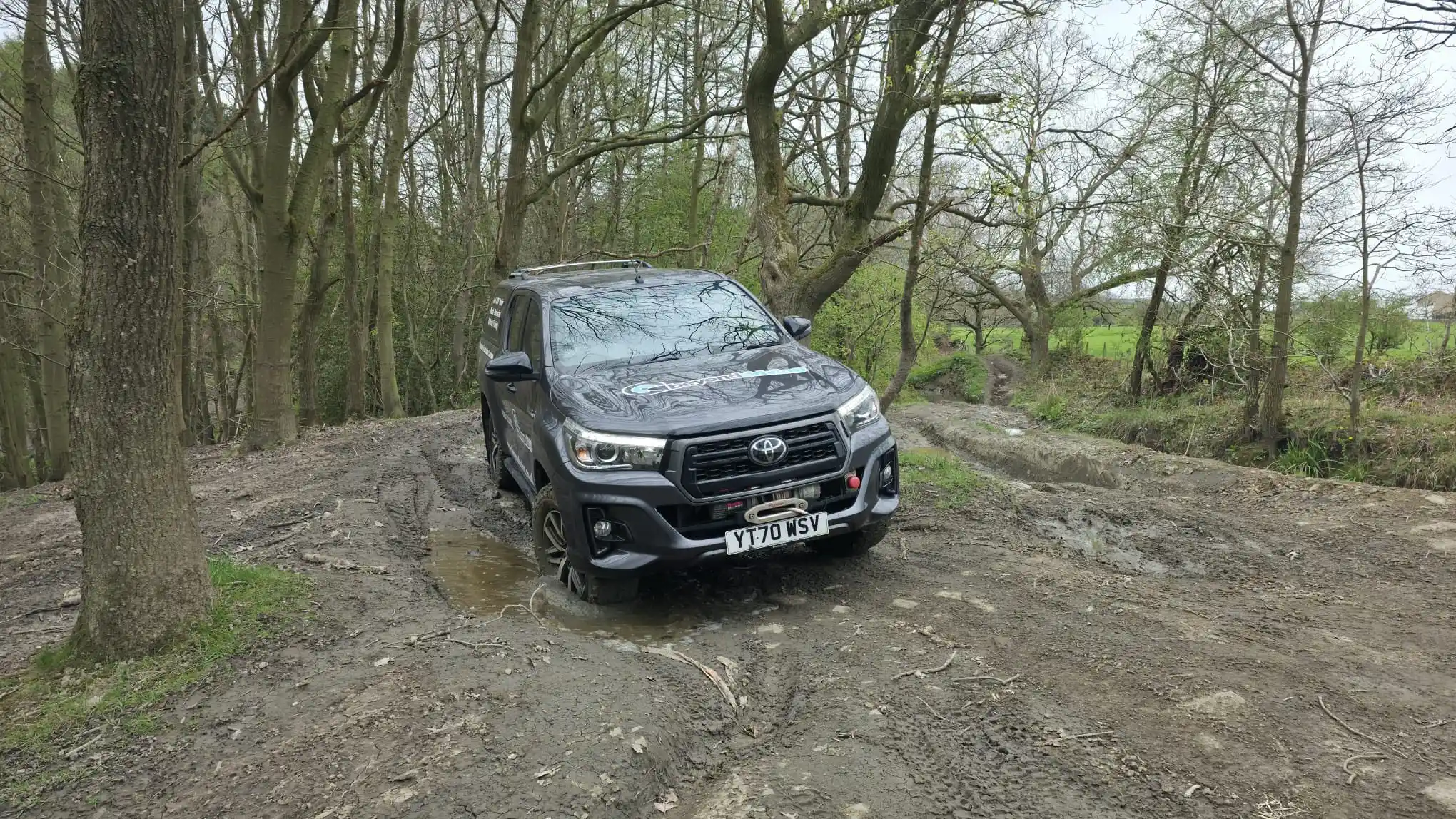 Off-road vehicle crossing water during Lantra 4x4 training near Bradford