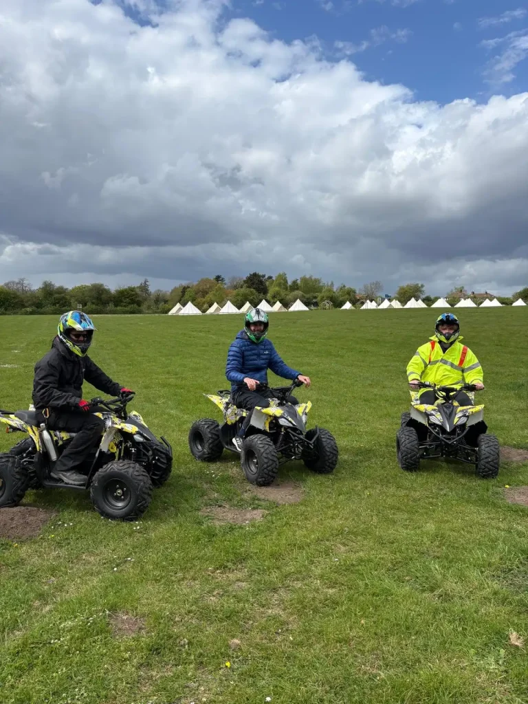     Kent Scouts adult staff with ATV and attached implement after Lantra ATV operator training