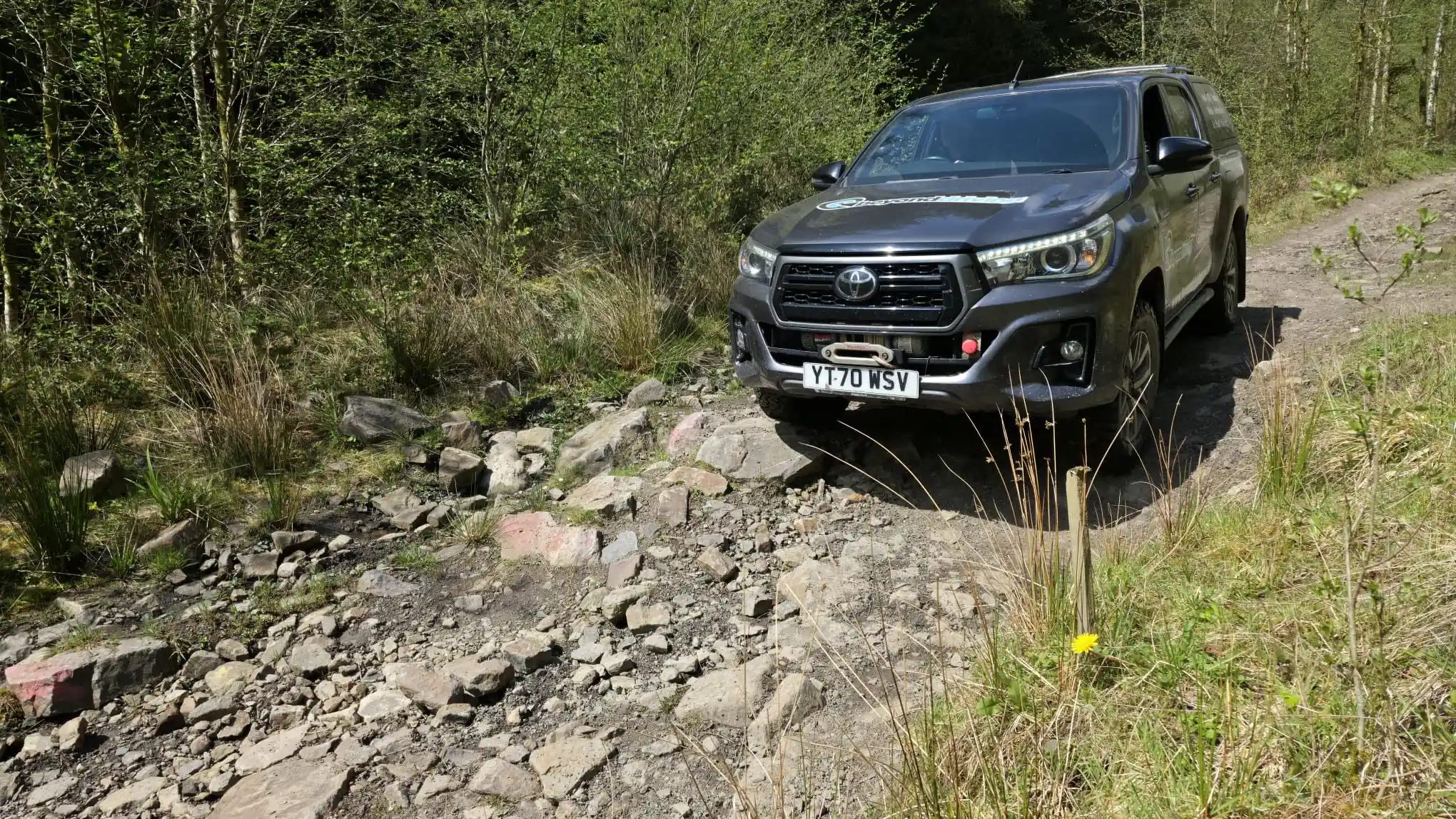 Beyond Driving 4x4 vehicle on rough rocky off road track during driver training near Neath