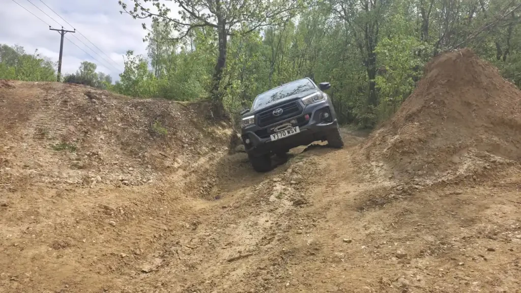 Beyond Driving 4x4 vehicle on steep uneven terrain during off road driver training near Chichester for BT