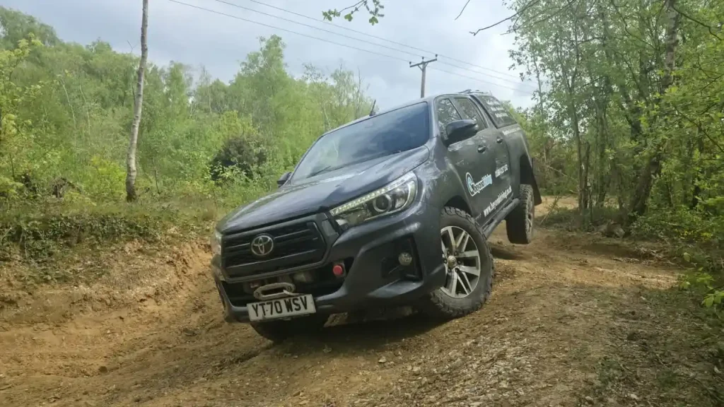     Beyond Driving 4x4 training vehicle on gravel track near Chichester during Lantra course for BT