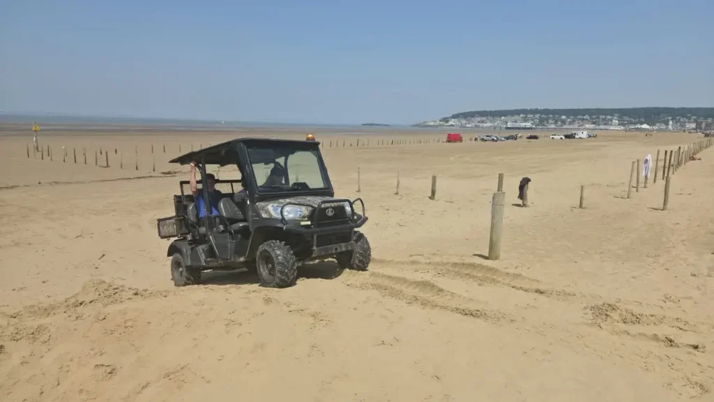 UTV operating on soft sand during beach driving training at Weston-super-Mare