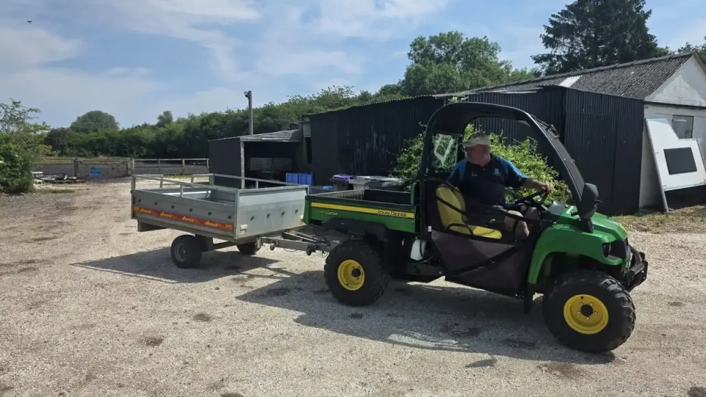 John Deere Gator towing a trailer during Lantra UTV training in Lincolnshire