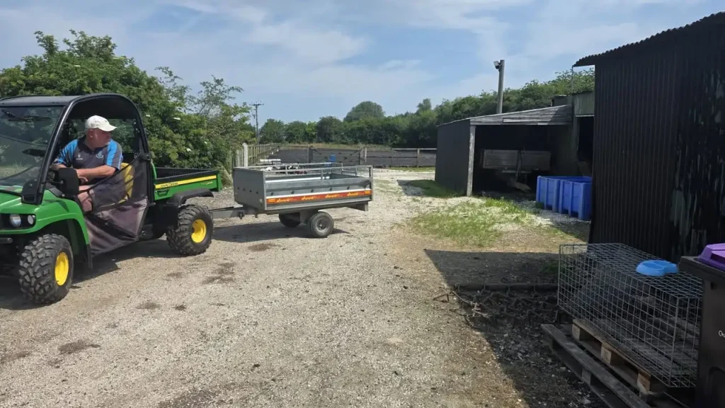 John Deere Gator towing a trailer during Lantra UTV training in Lincolnshire