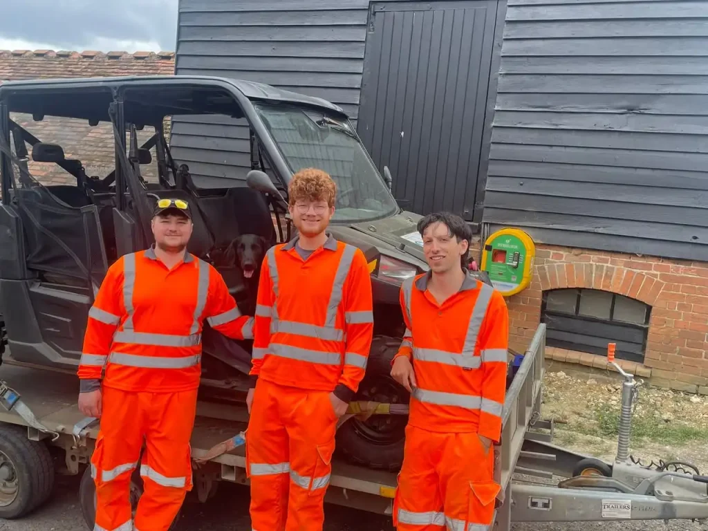 Zetica team members with UTV and trailer during training at Newbury
