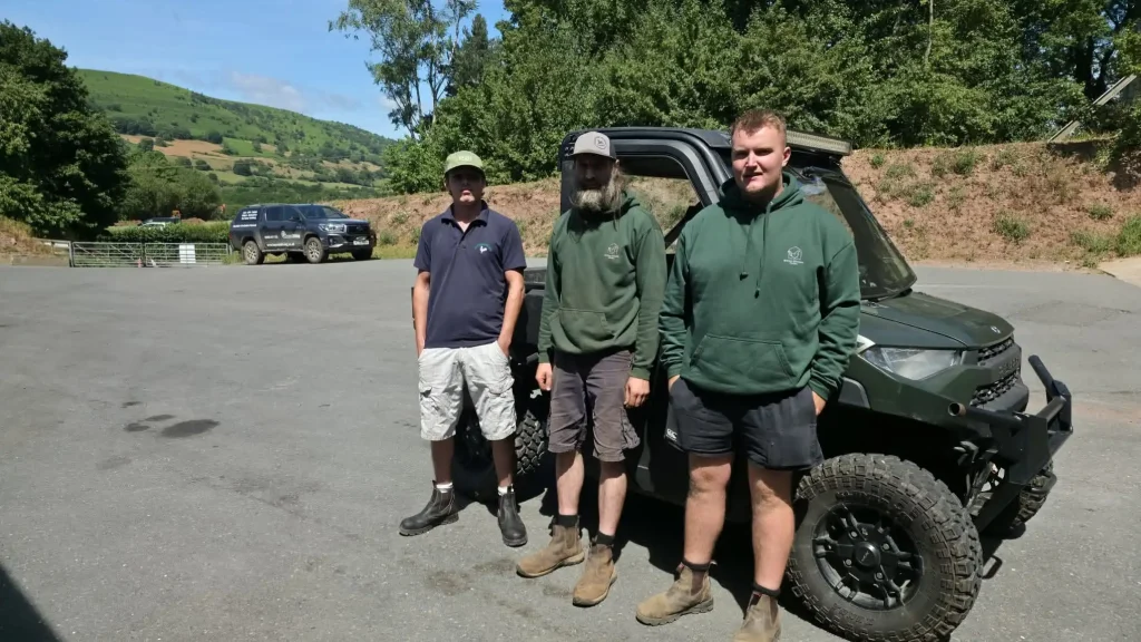 eyond Driving UTV training with operators beside a side-by-side vehicle
