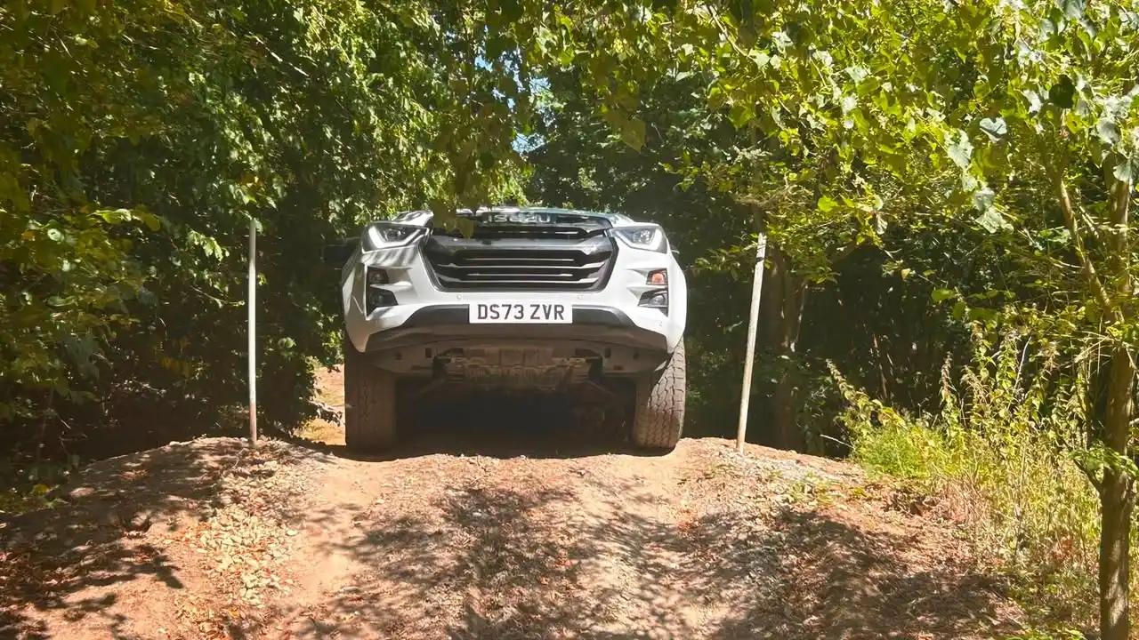 Exolum Isuzu D-Max on Lantra 4x4 operator training course tackling off-road terrain at Beyond Driving