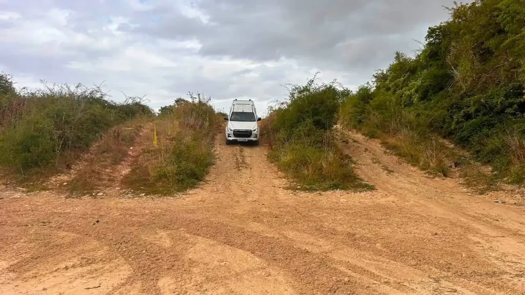     Exolum Isuzu D-Max crossing an off-road obstacle during professional Lantra 4x4 operator training